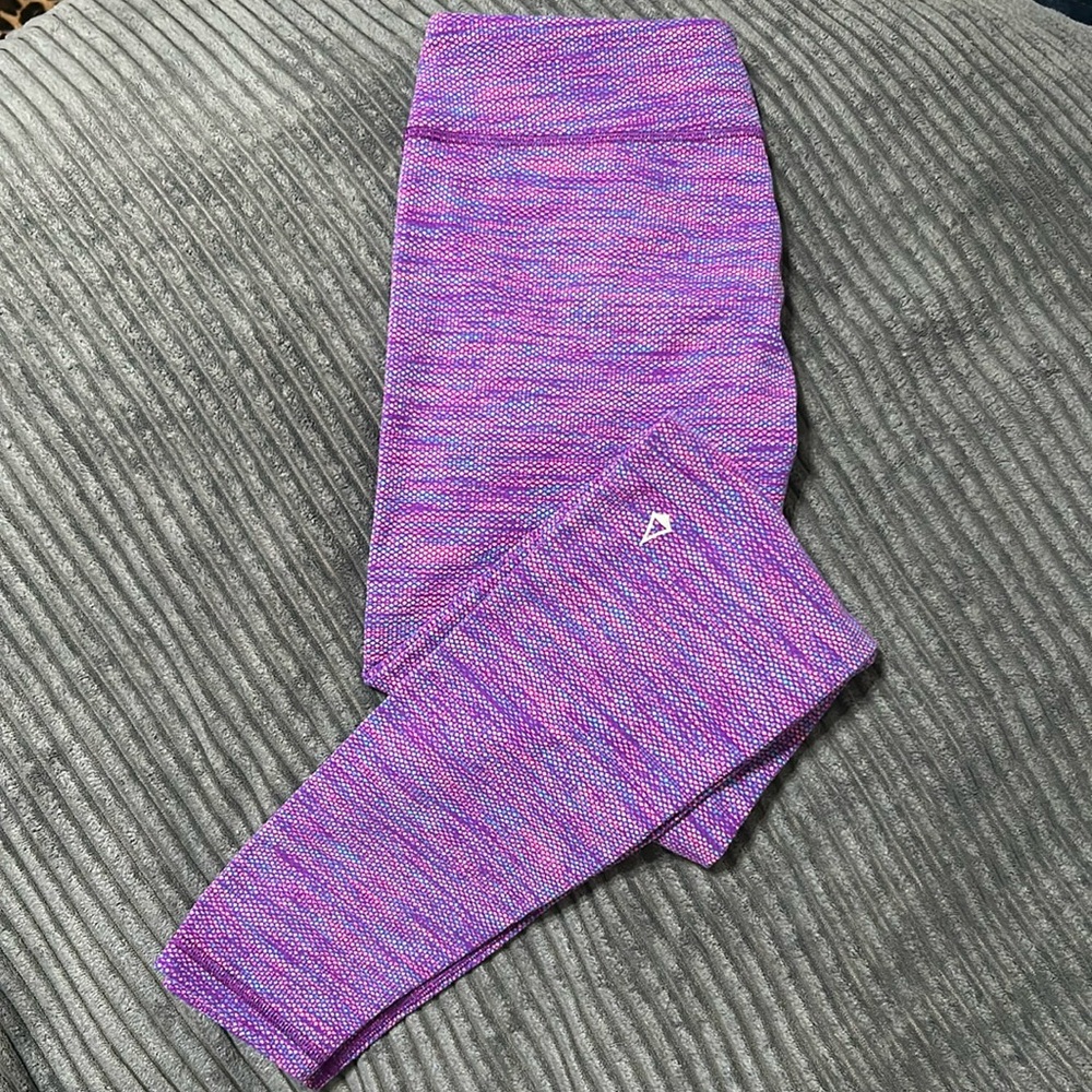 NWOT Ivivva purple multi colored leggings in great condition. Girls size 14